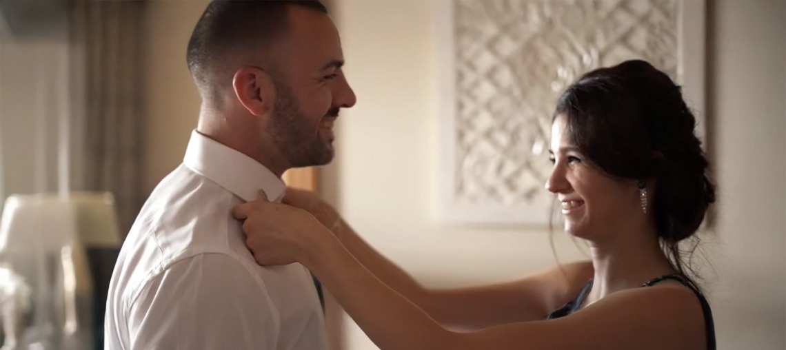 a green heart shaped leaf on a sandy beach