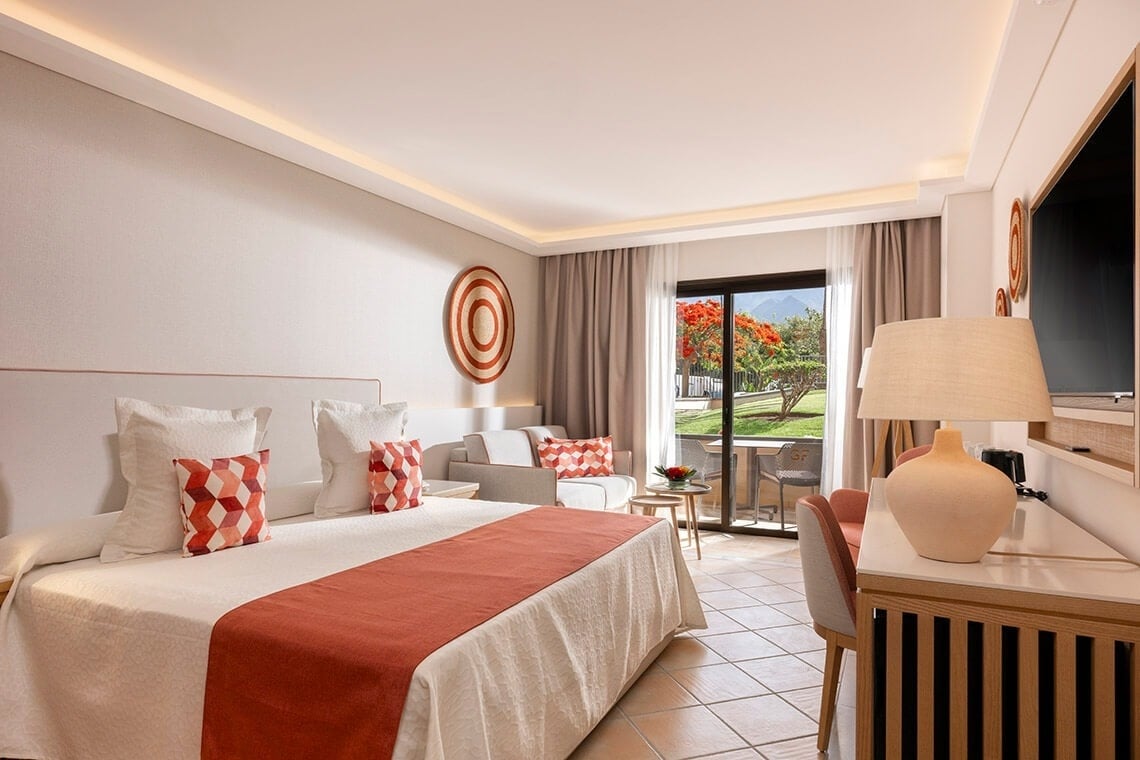 a hotel room with a large bed and a desk