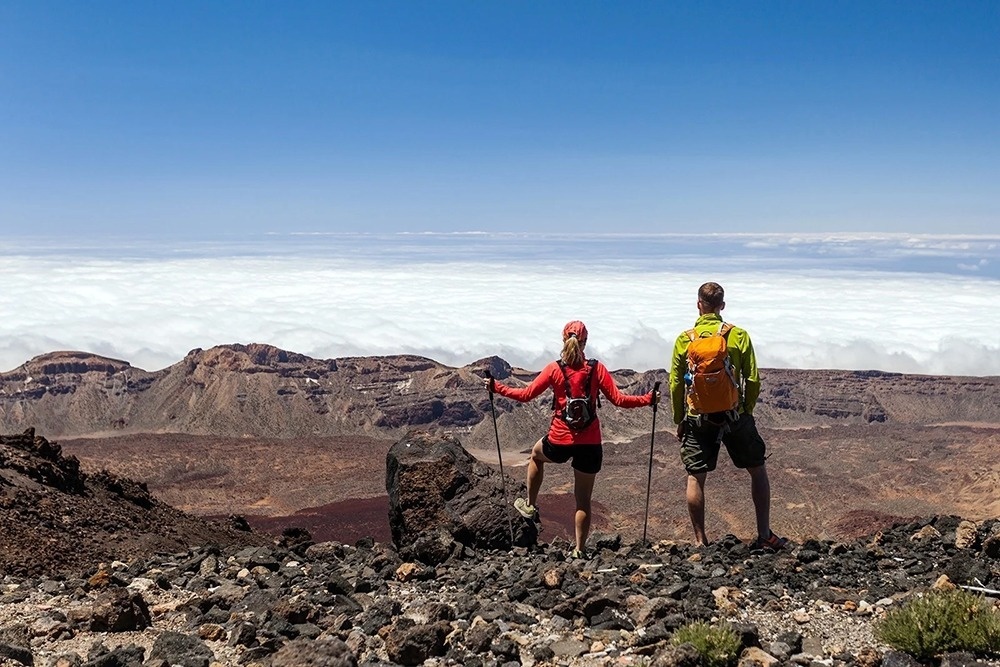 a dining room with tables and chairs and a candle on the table
