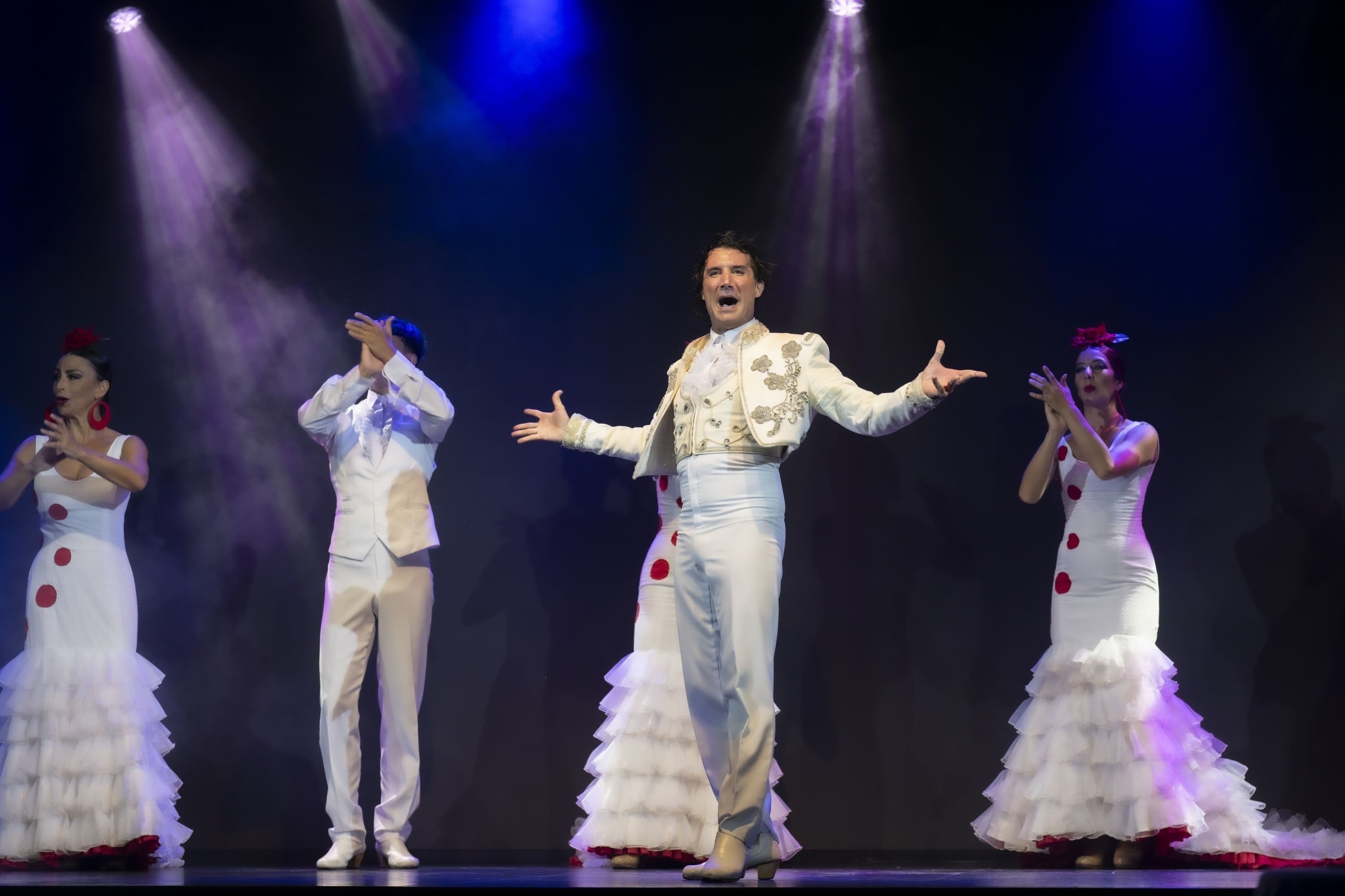 a man stands in front of a screen that says aire
