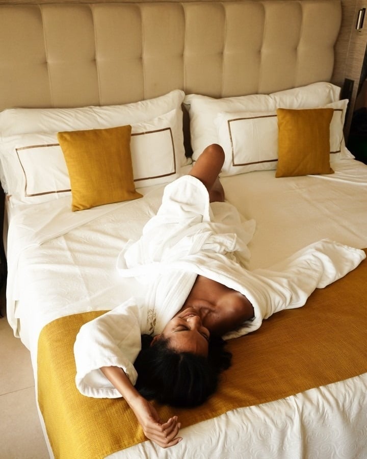 an aerial view of a sandy beach with blue water
