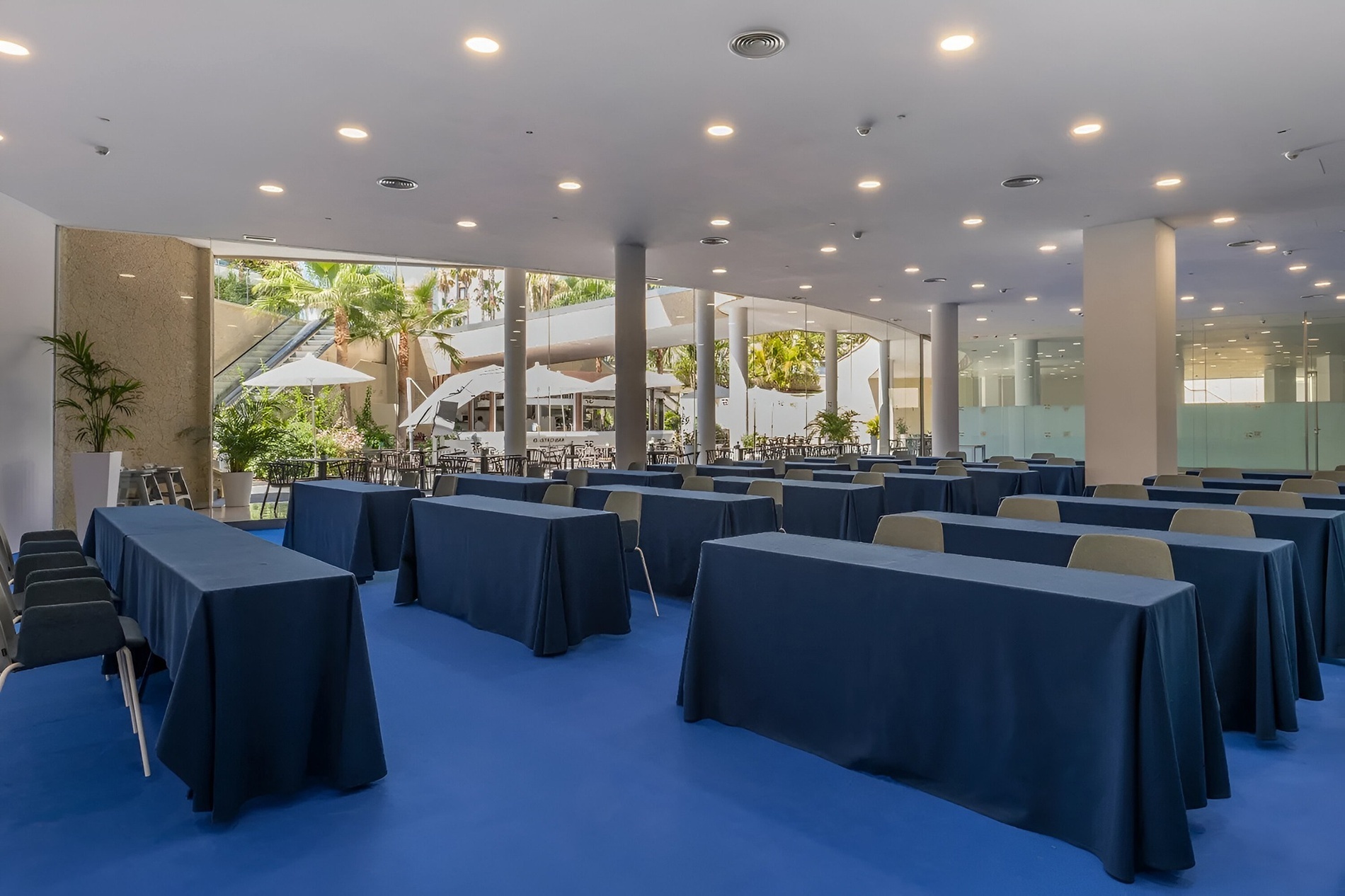 a large room with tables and chairs set up for a conference