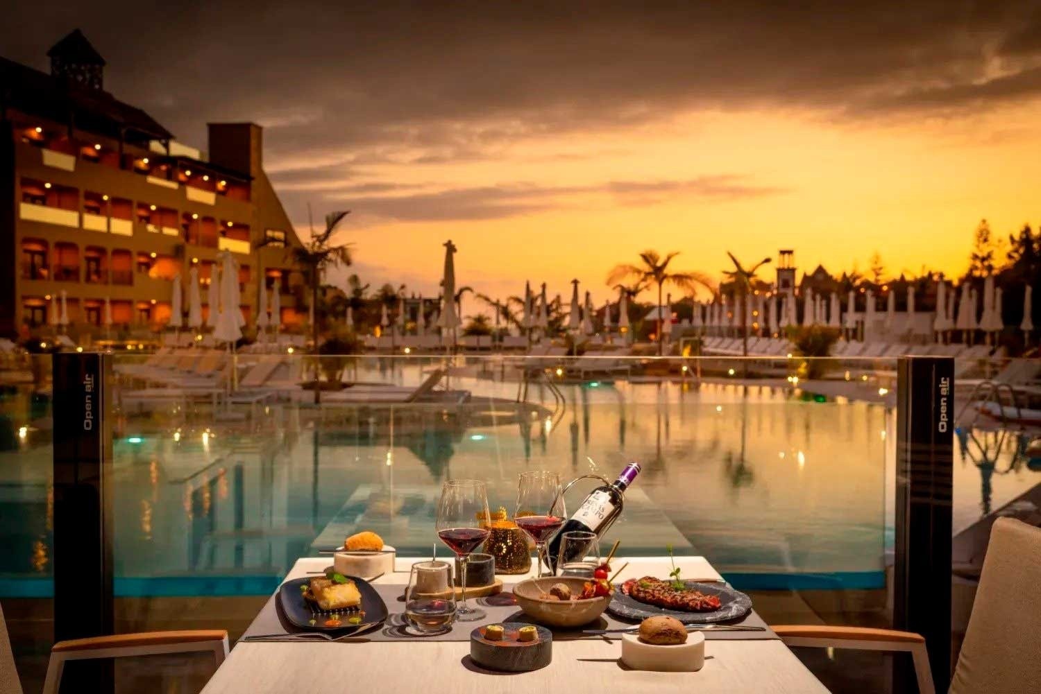 a dining room with tables and chairs and a candle on the table