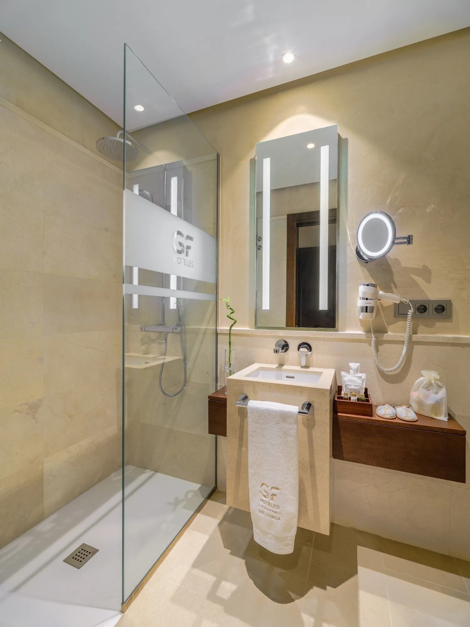 a glass of red liquid with a straw on the beach