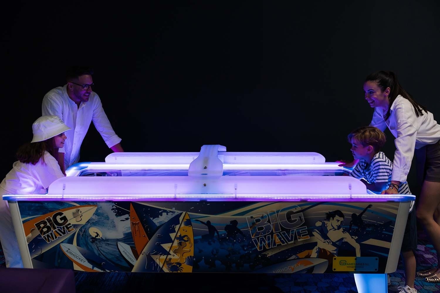 a family playing a game called big wave