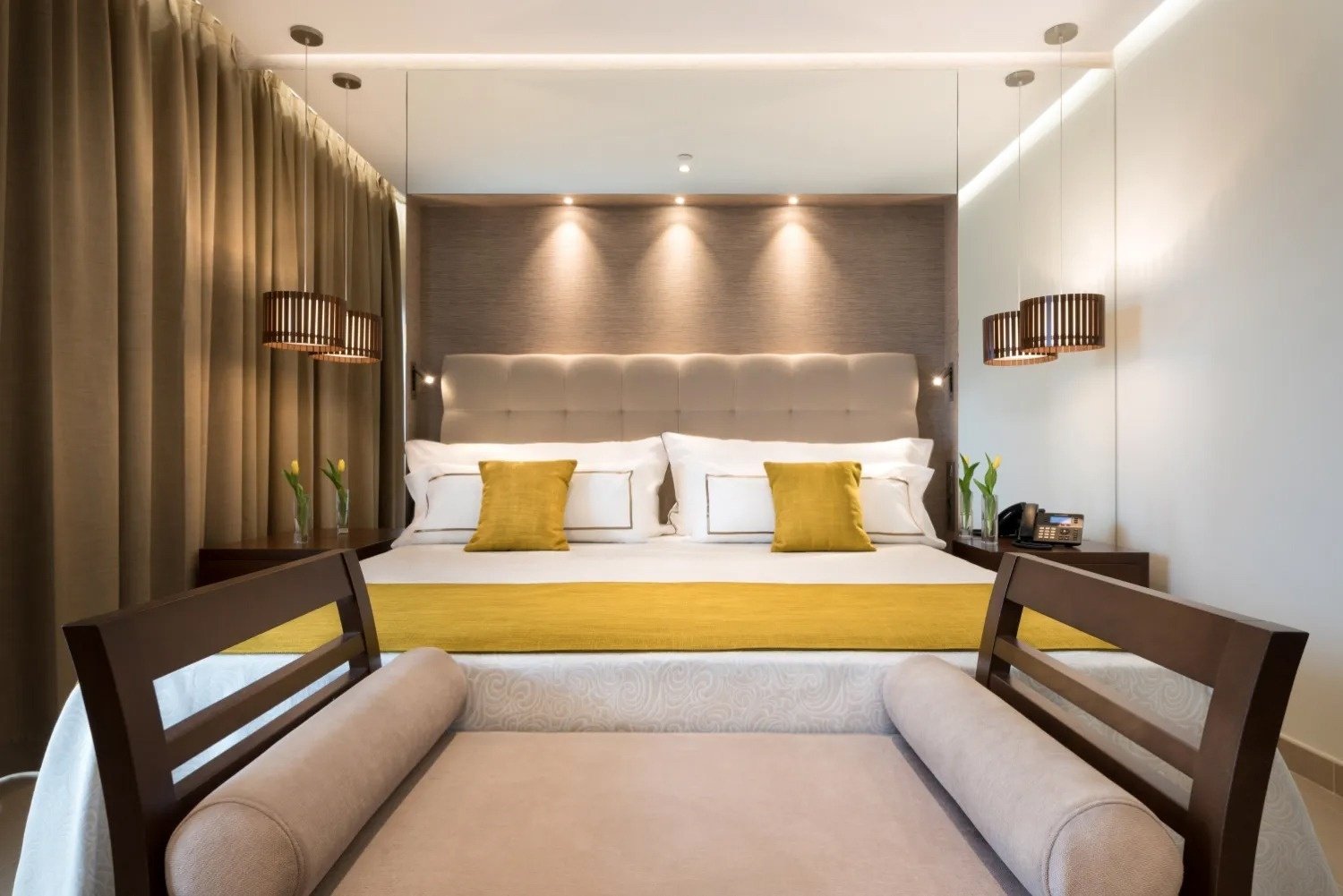 a hotel room with a bed and a chair