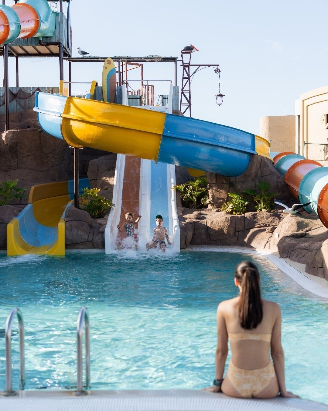 an aerial view of a sandy island in the middle of the ocean