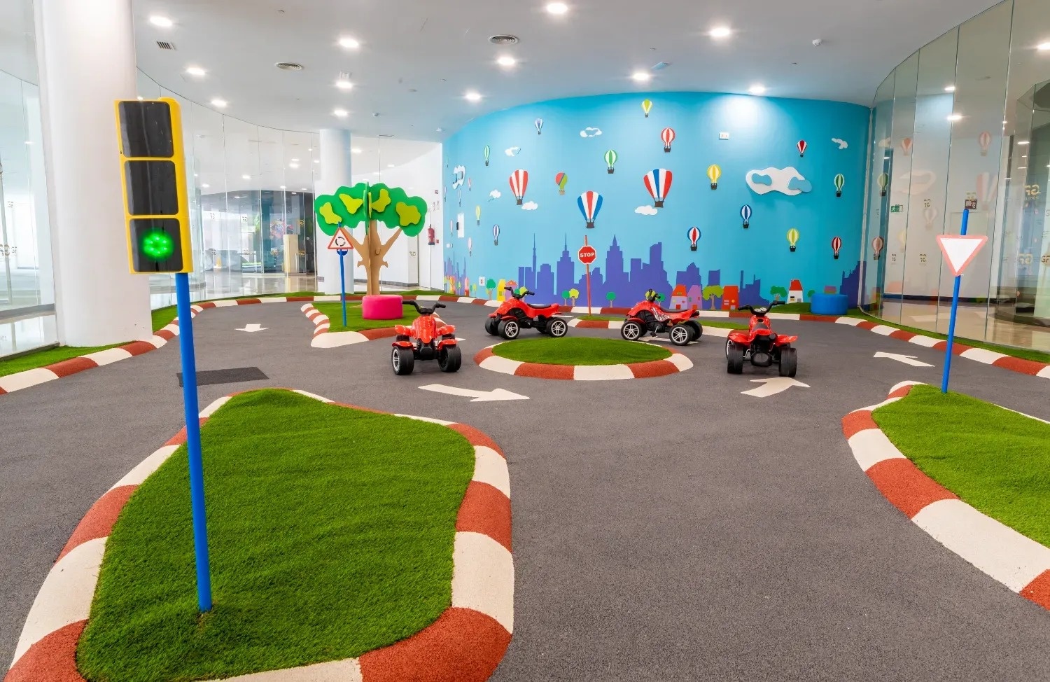 a large room with lots of colorful toys and fences