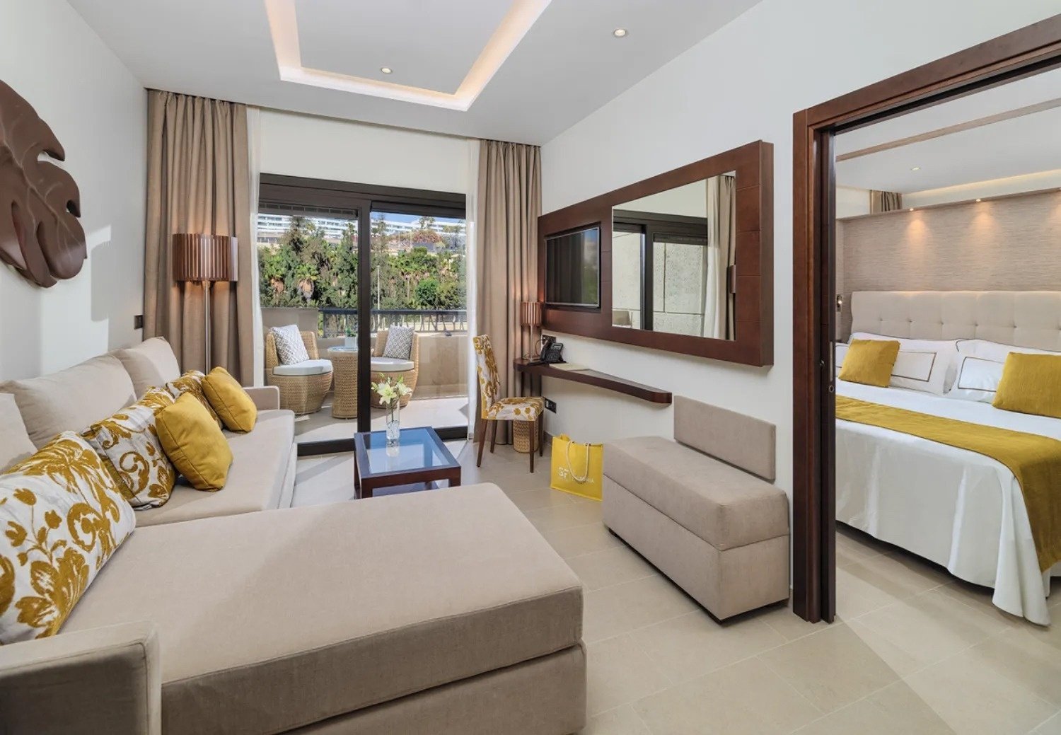 a hotel room with a couch and a bed