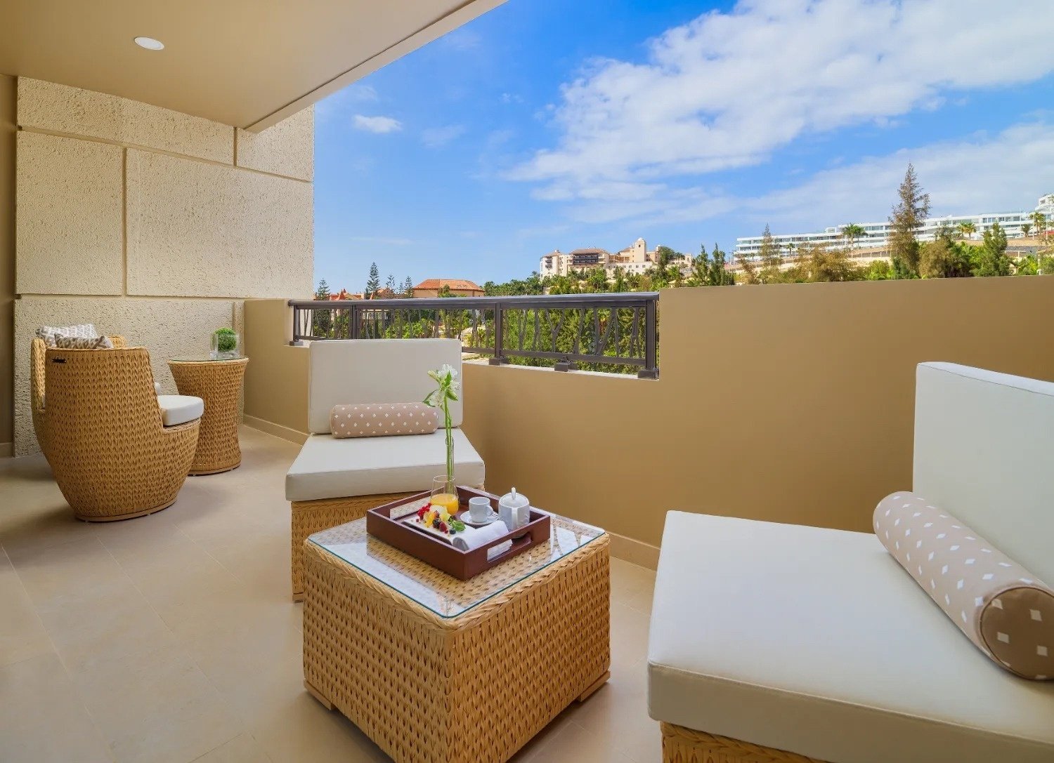 seagulls flying over the ocean at sunset