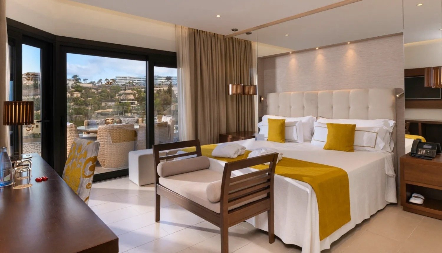 a hotel room with a large bed and a large window