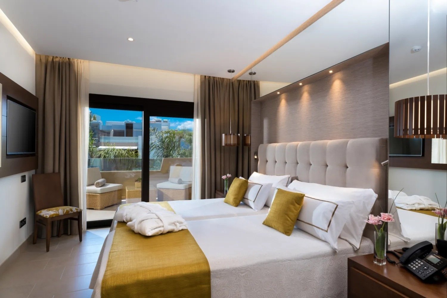 a hotel room with two beds and a television