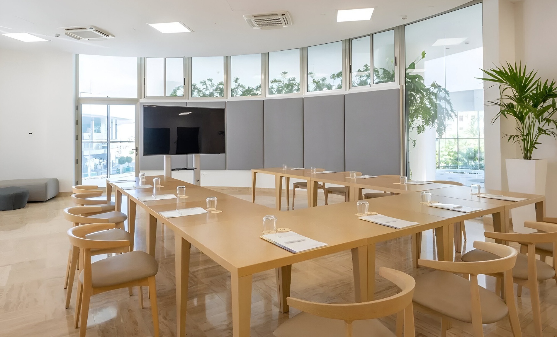 a large room with tables and chairs set up for a conference