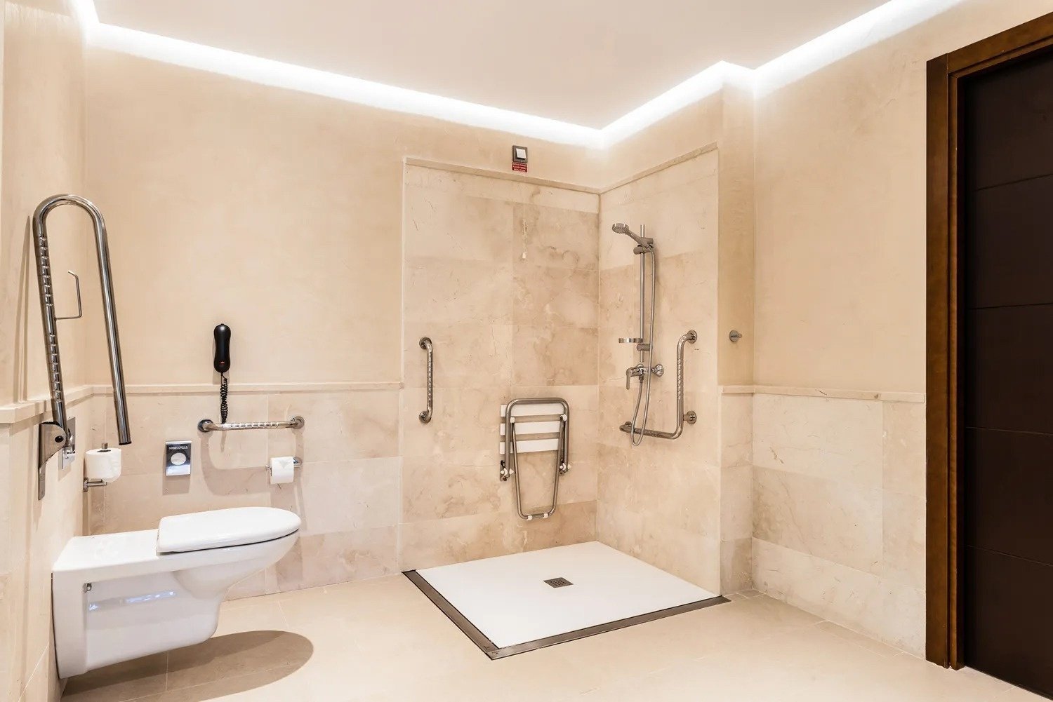 a bathroom with a toilet and a walk in shower