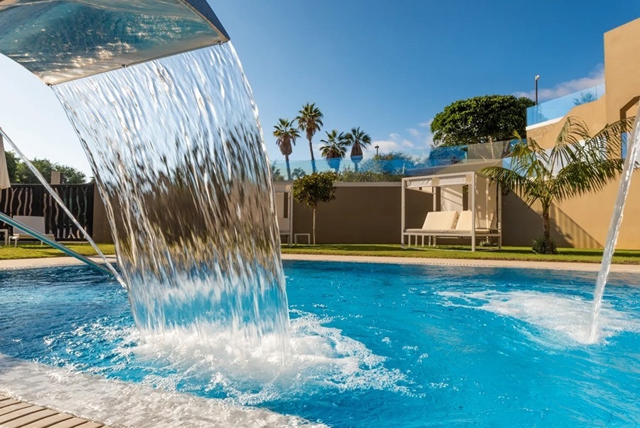 an aerial view of a sandy island in the middle of the ocean