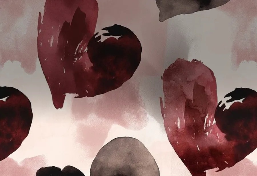 a pattern of red and black hearts on a pink background