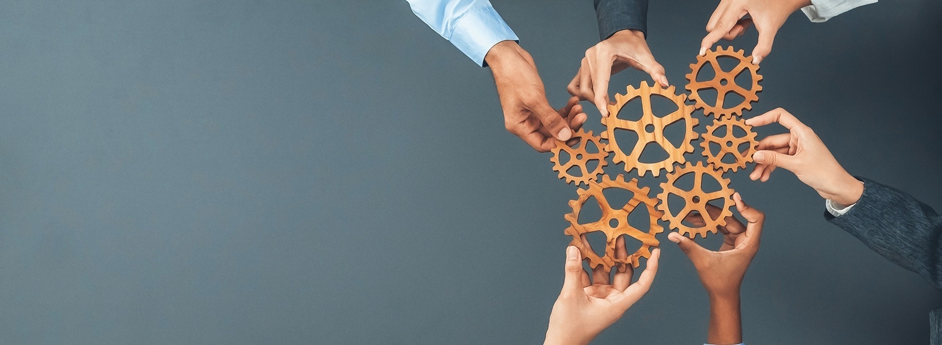 two people shaking hands over a table with a graph on it