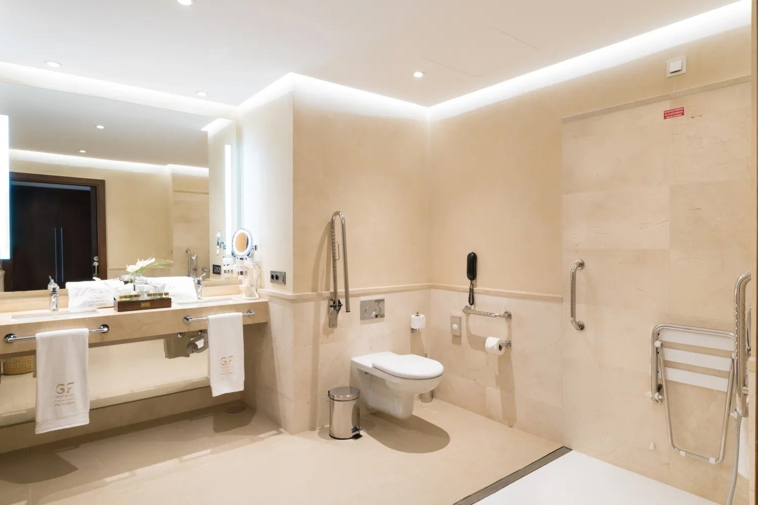 a bathroom with a toilet a sink and a mirror