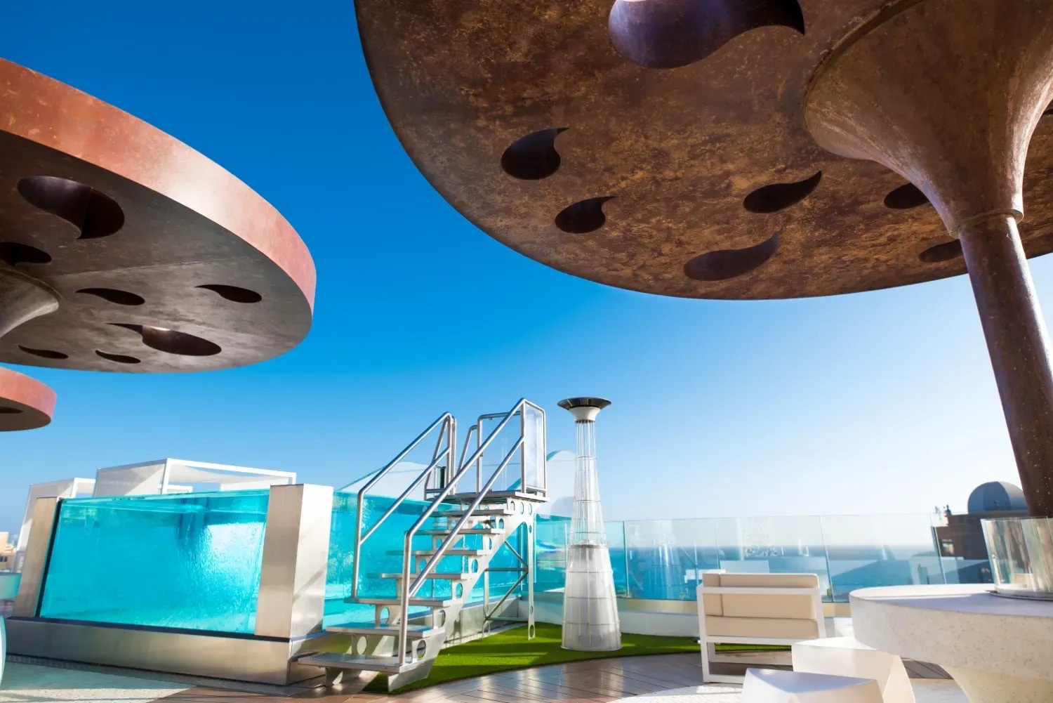 a swimming pool with stairs leading up to it