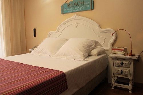 a bed with a sign above it that says beach