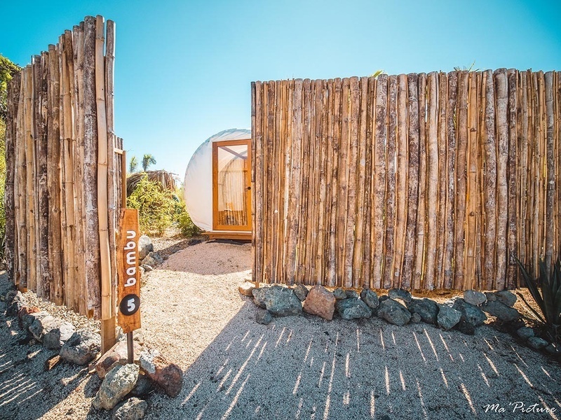 a wooden fence with a sign that says bambu on it
