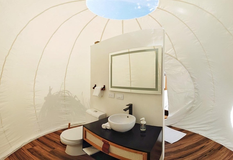 a bathroom with a toilet a sink and a mirror