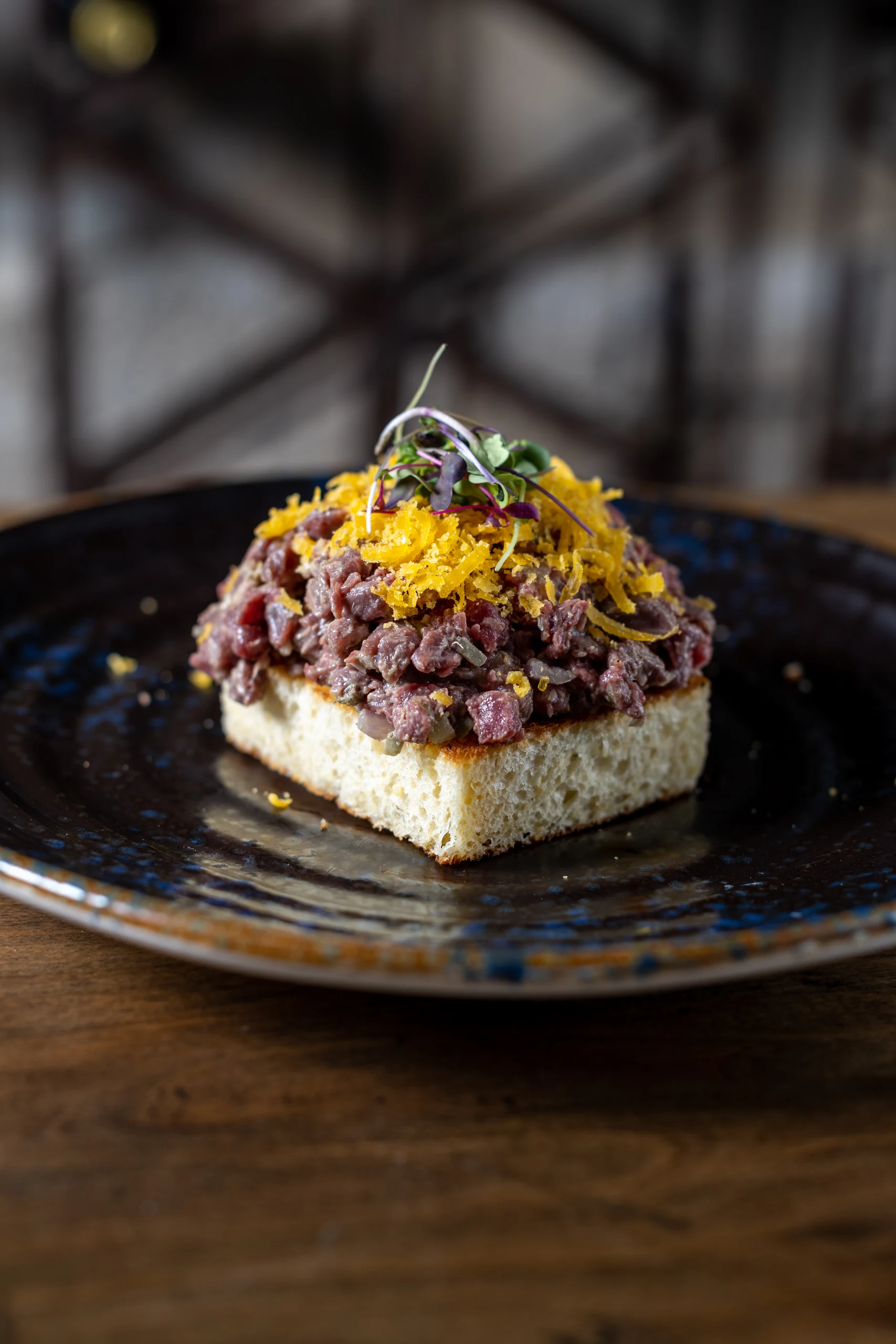 Gourmet beef tartare on toast, a culinary highlight from our Hacienda Zorita Wine Hotel.