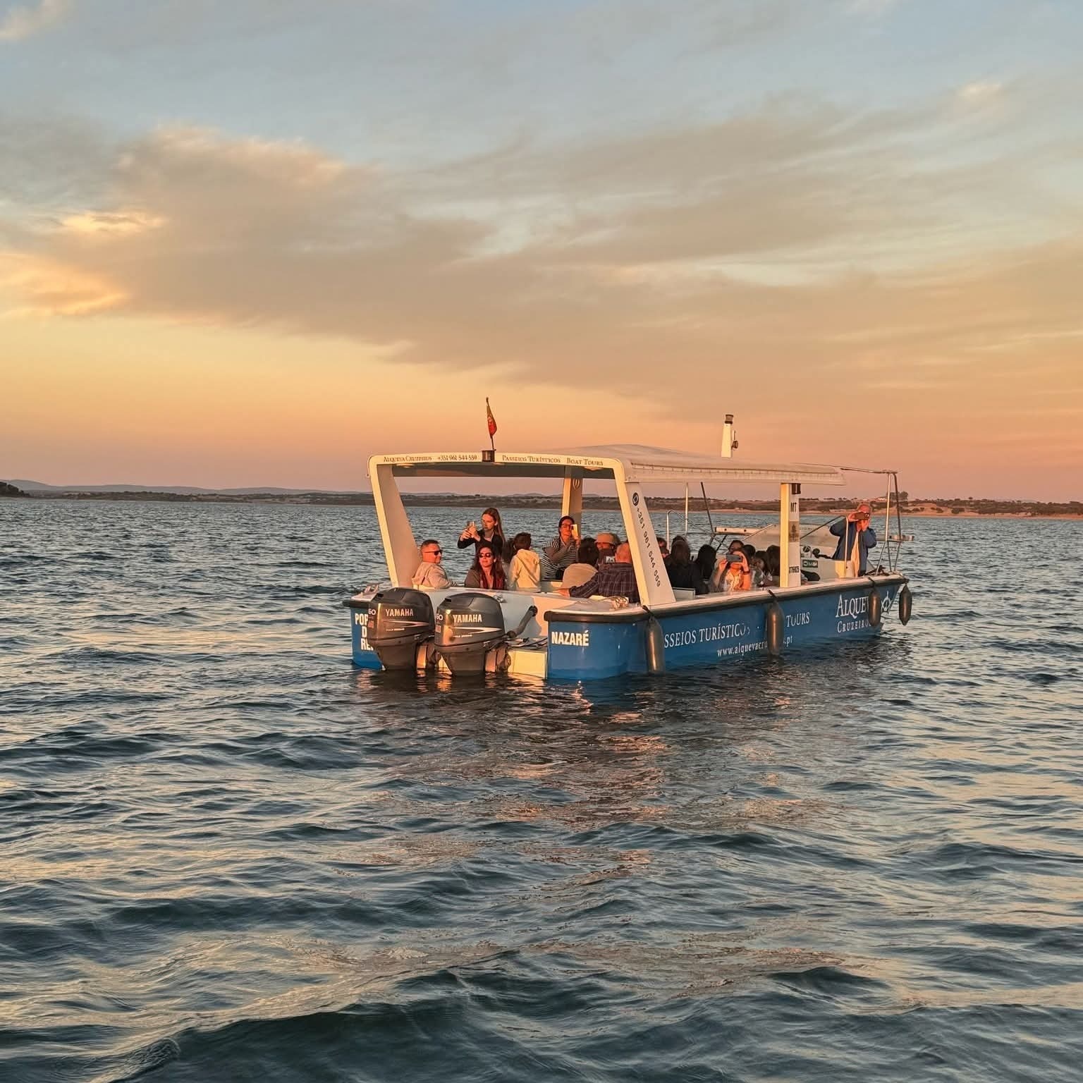 a group of people are on a boat that says laguna