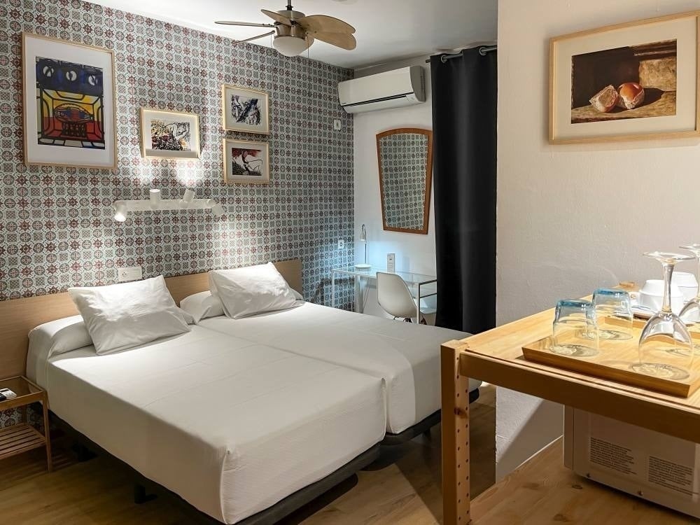Double room at Hostal Beatriz with balcony and sea view.