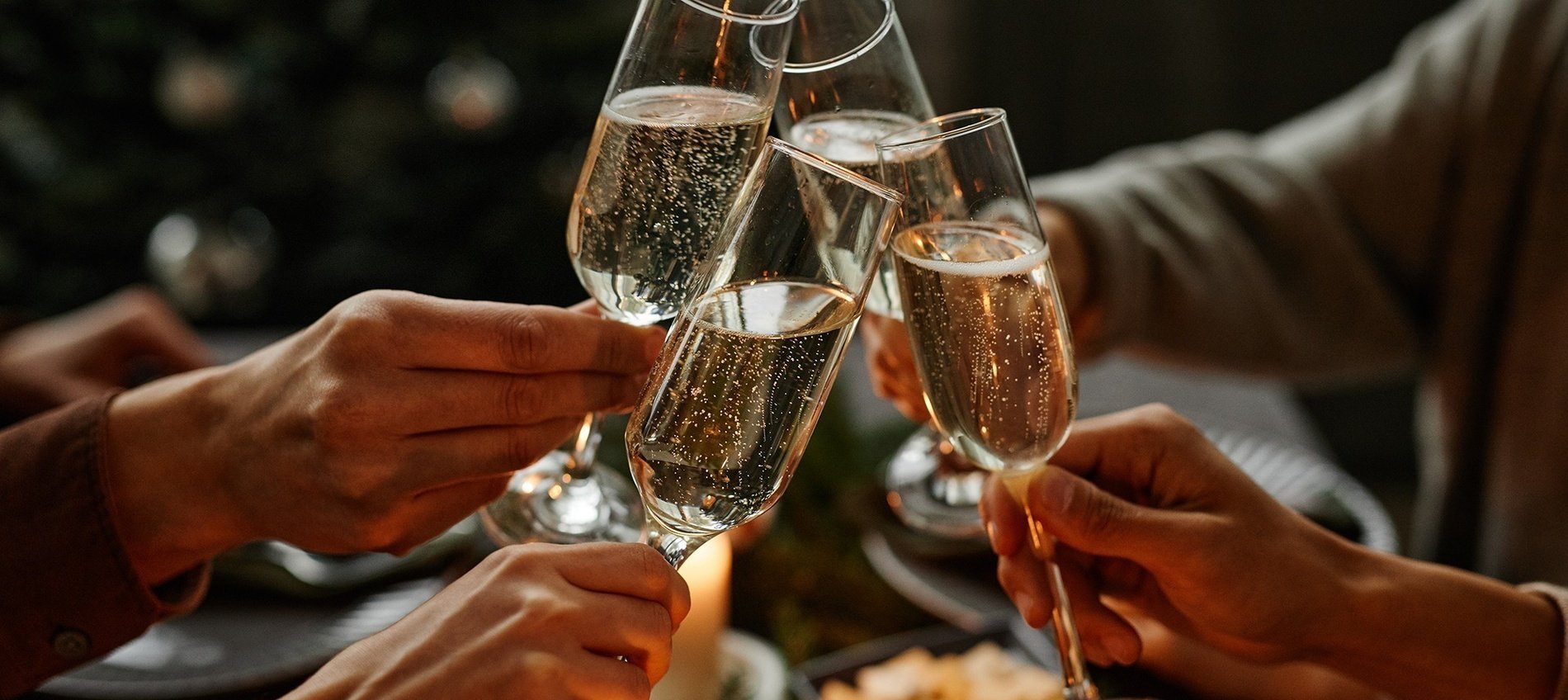 a group of people toasting with champagne glasses