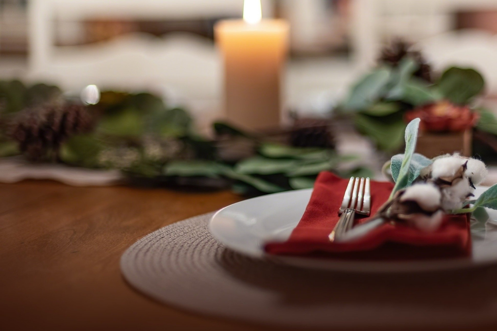 New Year's Eve Dinner in Nerja: Elegant table setting with a fork, red napkin, and festive decor.