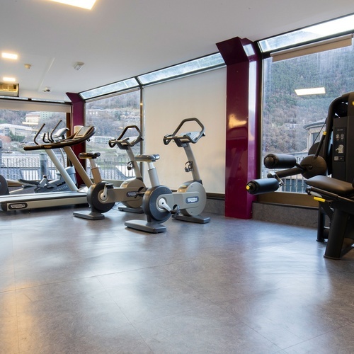 a gym with a machine that says technogym on it