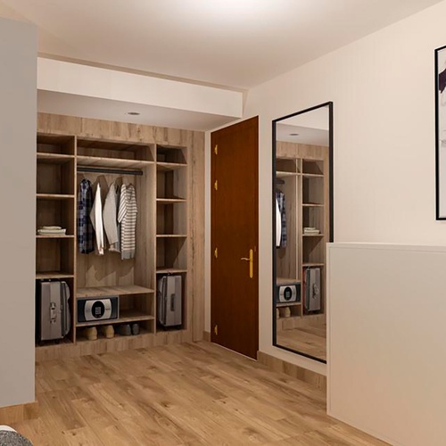 una habitación con un armario y dos cuadros en la pared