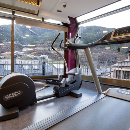 a treadmill with technogym written on it