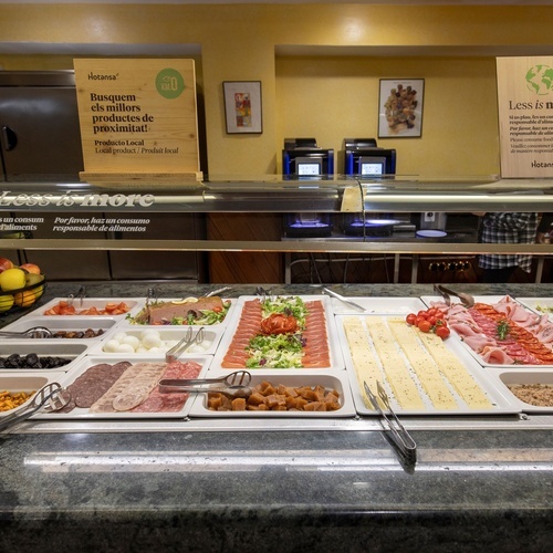 a buffet with a sign that says less is more