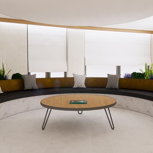 una sala de estar con un sofá curvo y una mesa redonda que dice hotel comptes
