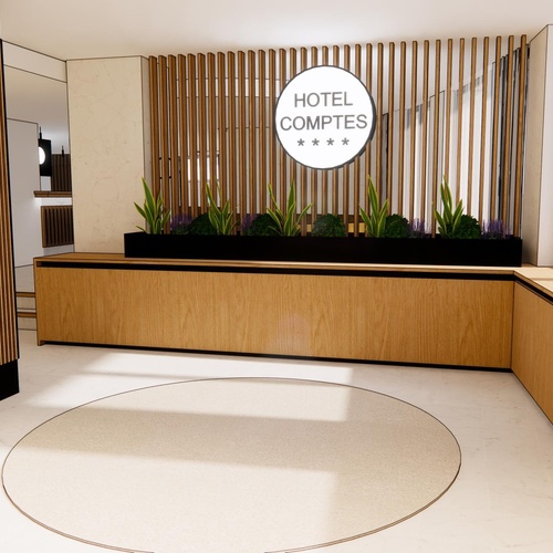 la recepción del hotel comptes está decorada con madera y plantas