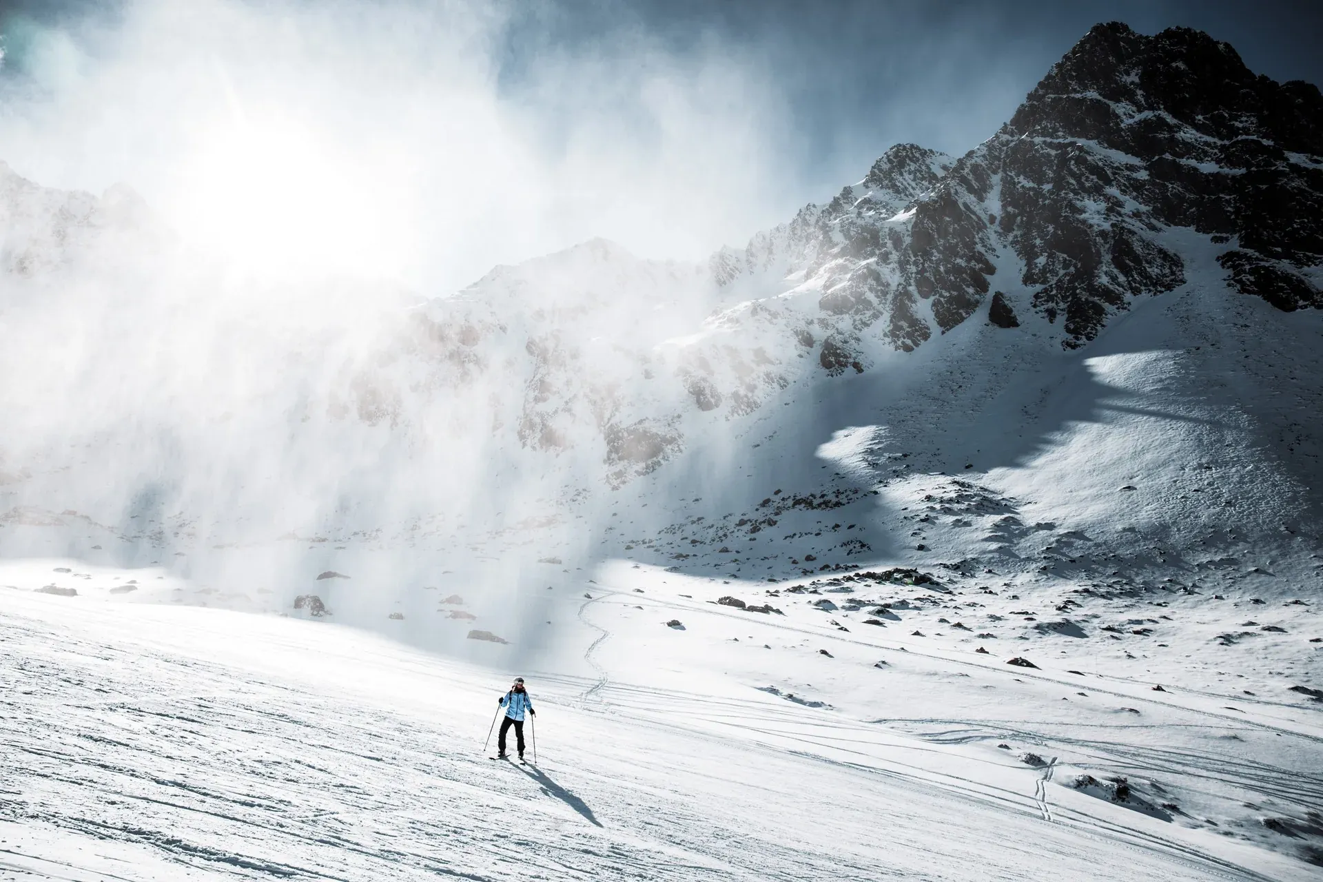 Lone skier on a sunny day, NEXTA: Corporativa trail for ultimate adventure.