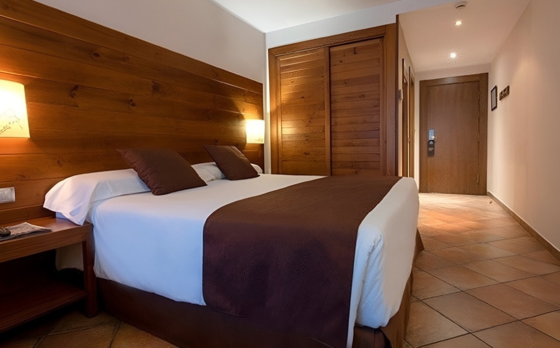 a man and two women giving a peace sign and a thumbs up