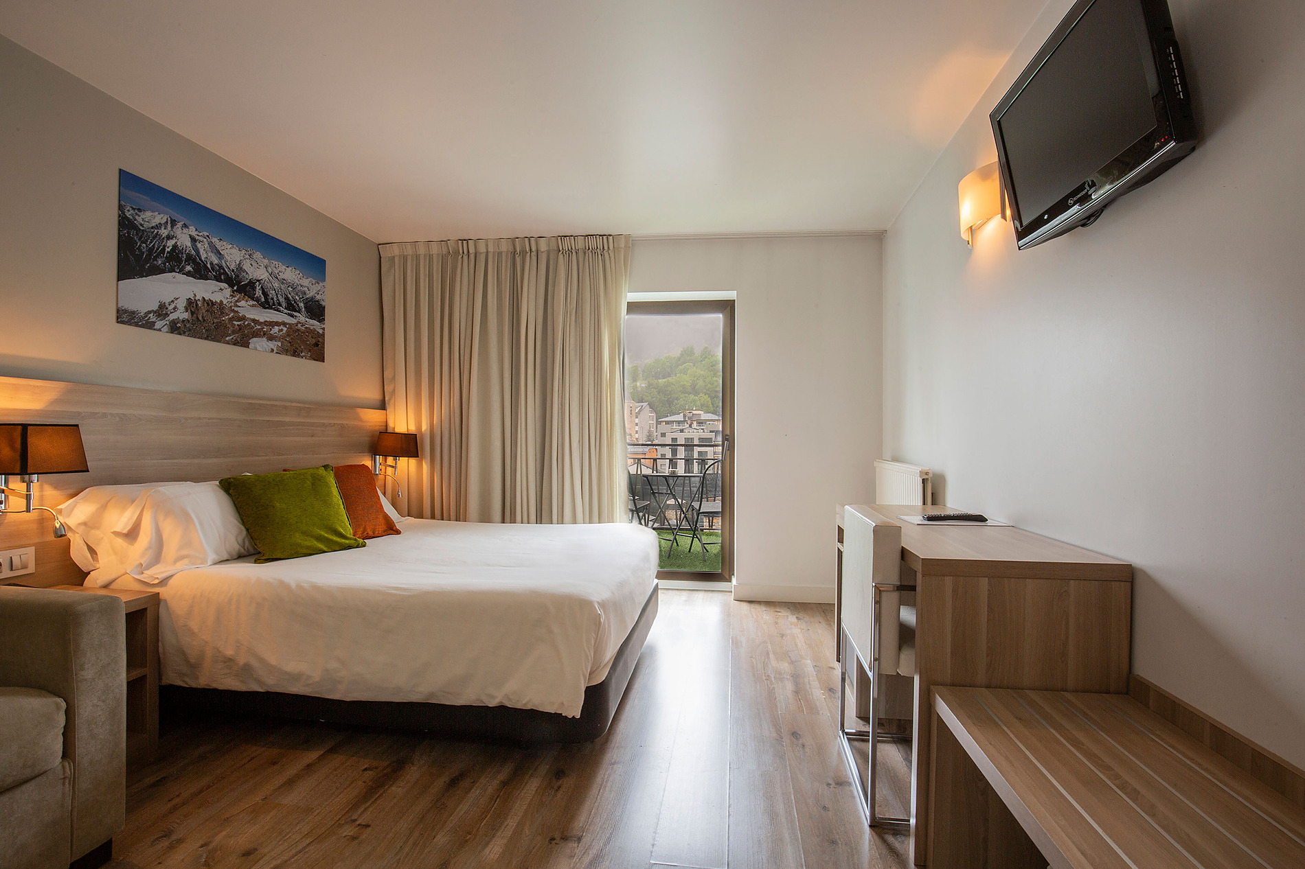 Bedroom with balcony view at Hotel Del Pui | Nexta. Official website.