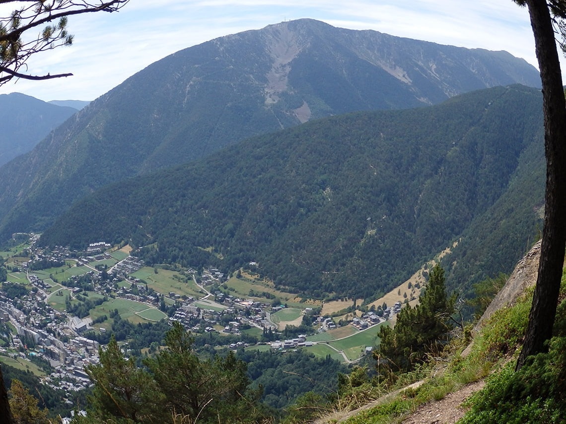 a view of a valley with a mountain in the background