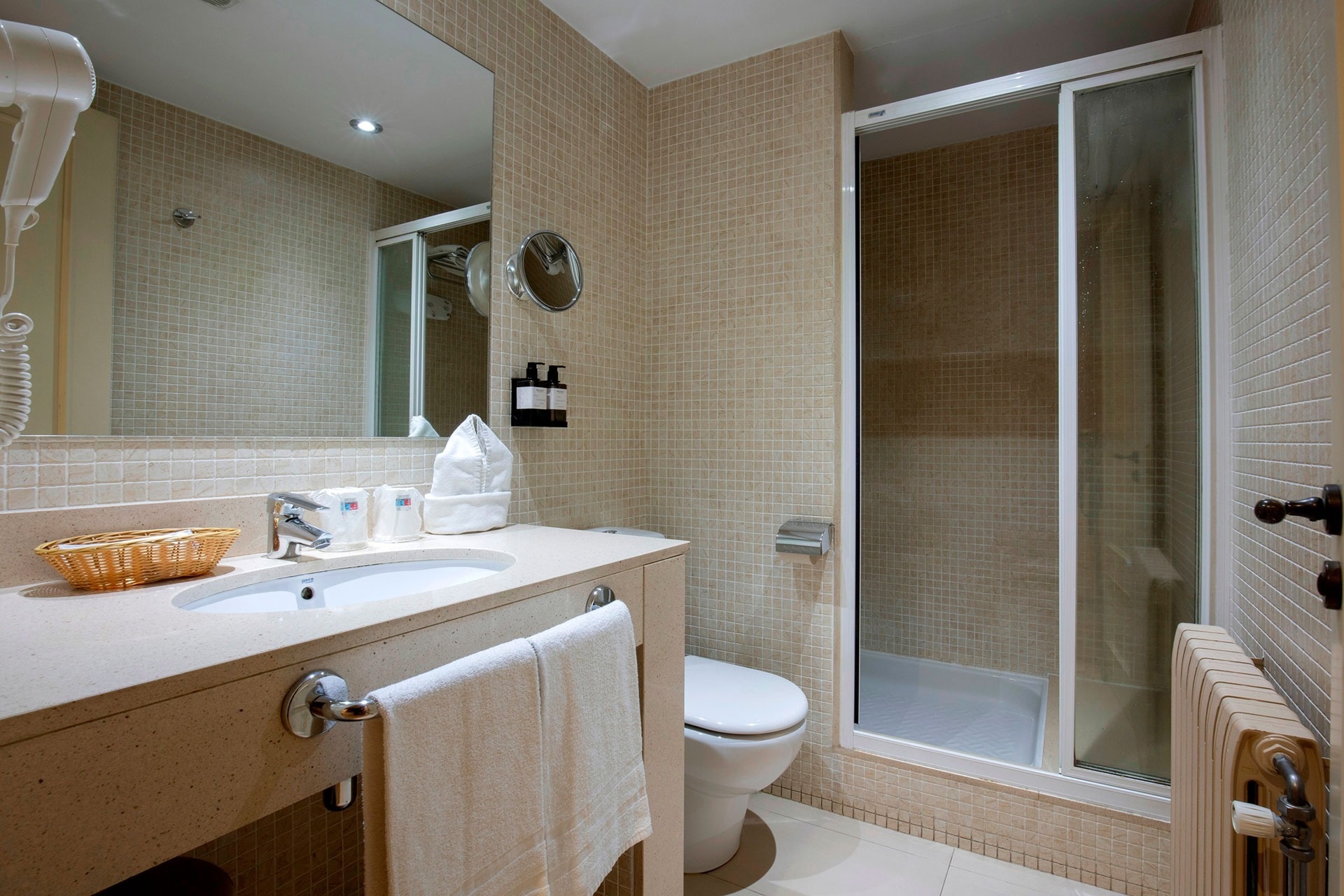 a bathroom with a toilet a sink and a mirror