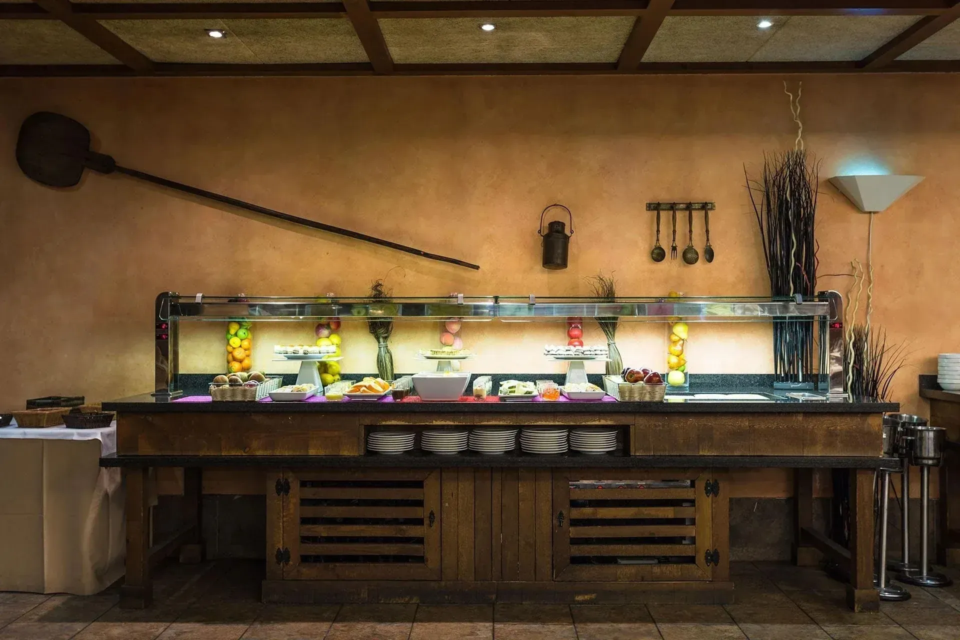 NEXTA Corporate buffet with fruits, desserts, and rustic decor.