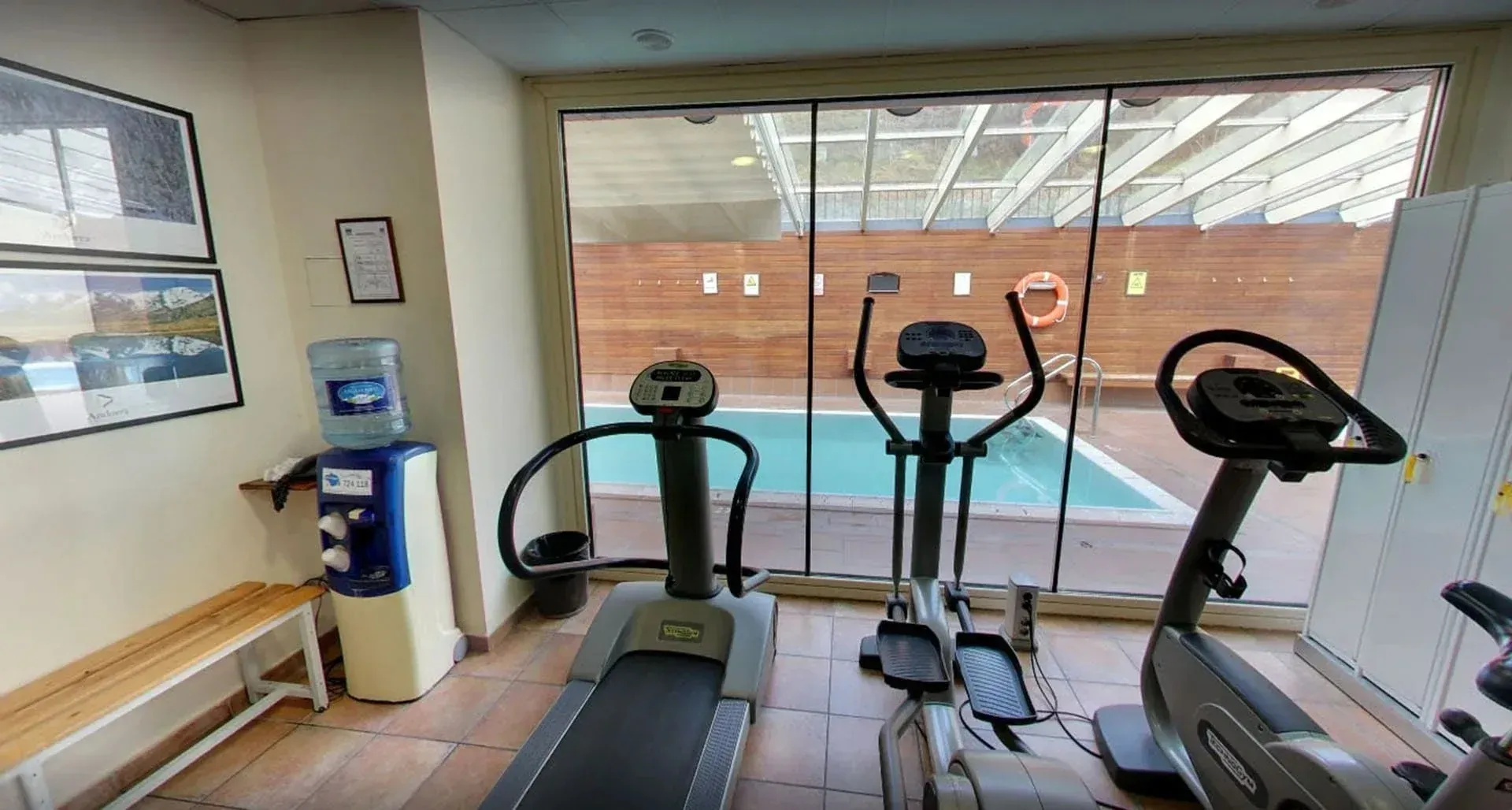 Gym with outdoor pool views, perfect for NEXTA: Corporativa.