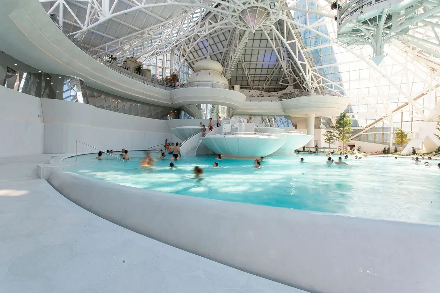 NEXTA: Corporativa indoor pool with people enjoying.