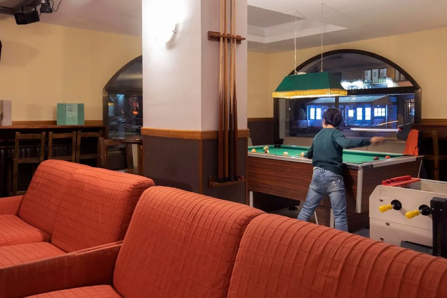 NEXTA: Corporativa game room with pool table and foosball.