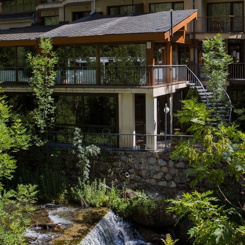 a building with a waterfall in front of it