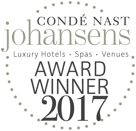En prickad cirkellogotyp med texten "Condé Nast Johansens Award Winner 2017" som lyfter fram lyxhotell, spa och mötesplatser.
