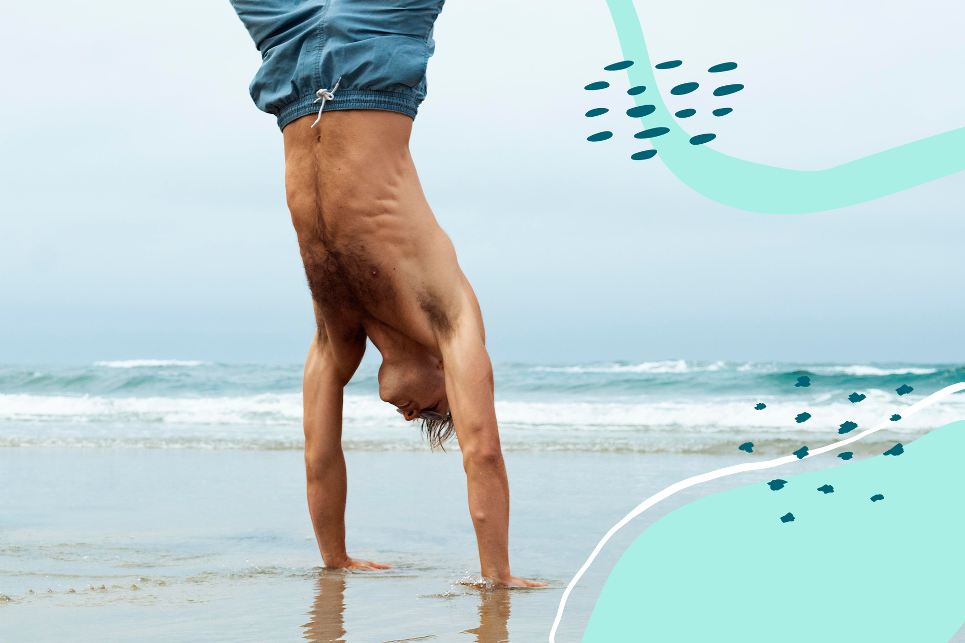 a man is doing a handstand on the beach