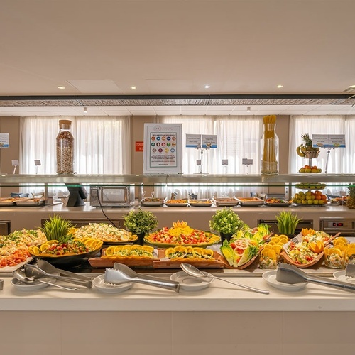 a buffet with a sign that says ' healthy choices ' on it